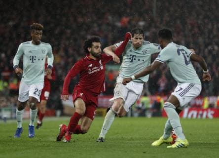 Javi Martinez of Bayern Munich tackles Mohamed Salah of Liverpool during the UEFA Champions League Round of 16 First Leg match at Anfield Stadium, Liverpool. Picture date: 19th February 2019. Picture credit should read: Darren Staples Sportimage EDITORIAL USE ONLY. No use with unauthorised audio, video, data, fixture lists, club league logos or live services. Online in-match use limited to 120 images, no video emulation. No use in betting, games or single club league player publications. _AZ13019.JPG