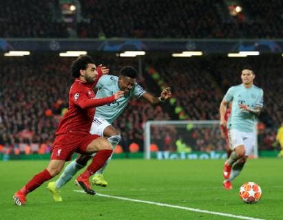 19th February 2019, Anfield, Liverpool, England; UEFA Champions League round of 16, Liverpool versus Bayern Munich; Mohamed Salah of Liverpool races after the ball on the edge of the penalty area challenged by David Alaba of Bayern Munich  ActionPlus12106885 DavidxBlunsden