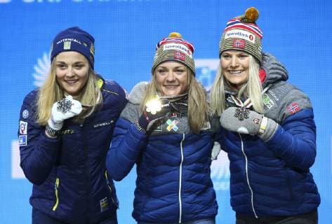 NORDIC SKIING - FIS Nordic World Ski Championships Seefeld 2019 SEEFELD,AUSTRIA,22.FEB.19 - NORDIC SKIING, CROSS COUNTRY SKIING - FIS Nordic World Ski Championships, medal plaza, award ceremony, sprint, ladies. Image shows Stina Nilsson (SWE), Maiken Caspersen Falla (NOR) and Mari Eide (NOR). GEPAxpictures xCh.xKelemen