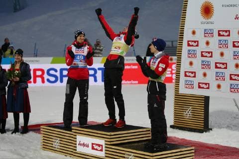 NORDIC SKIING - FIS Nordic World Ski Championships Seefeld 2019 SEEFELD,AUSTRIA,01.MAR.19 - NORDIC SKIING, Ski jumping Skispringen Ski nordisch - FIS Nordic World Ski Championships, normal hill, flower ceremony. Image shows Kamil Stoch (POL), Dawid Kubacki (POL) and Stefan Kraft (AUT). GEPAxpictures xThomasxBachun