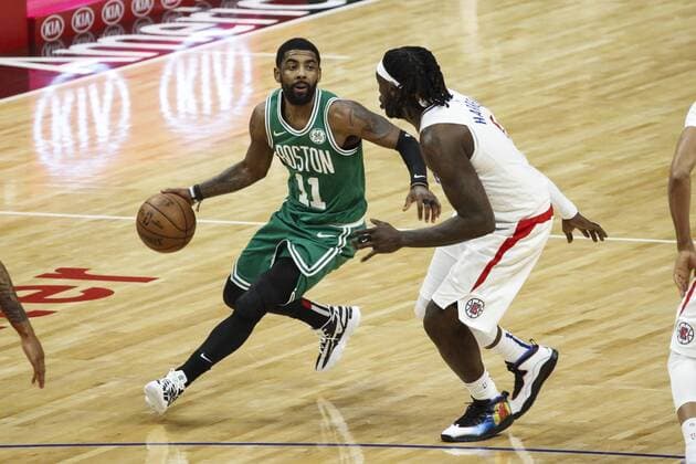 March 11, 2019 - Los Angeles, California, U.S - Boston Celtics Kyrie Irving (11) drives against Los Angeles ClippersÃ¢â‚¬â ¢ Montrezl Harrell (5) during an NBA Basketball Herren USA basketball game between Los Angeles Clippers and Boston Celtics, Monday, March 11, 2019, in Los Angeles. NBA 2019: Clippers vs Celtics - ZUMAc68_ 20190311_zaf_c68_023 Copyright: xRingoxChiux