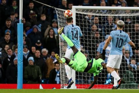 Salif Sane of FC Schalke 04 kicks Aymeric Laporte of Manchester City whilst attempting an overhead kick during the UEFA Champions League Round of 16 match at the Etihad Stadium, Manchester. Picture date: 12th March 2019. Picture credit should read: James Wilson Sportimage EDITORIAL USE ONLY. No use with unauthorised audio, video, data, fixture lists, club league logos or live services. Online in-match use limited to 120 images, no video emulation. No use in betting, games or single club league player publications. SPI_3678.JPG