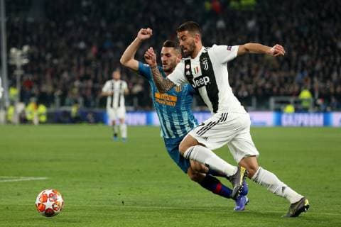 Leonardo Spinazzola of Juventus and Koke of Atletico Madrid during the UEFA Champions League Round of 16 match at the Allianz Stadium, Turin, Italy. Picture date 12th March 2019. Picture credit should read: Jonathan Moscrop Sportimage EDITORIAL USE ONLY. No use with unauthorised audio, video, data, fixture lists, club league logos or live services. Online in-match use limited to 120 images, no video emulation. No use in betting, games or single club league player publications. SOLO0805.JPG