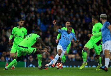 12th March 2019, Etihad Stadium, Manchester, England; UEFA Champions League football, round of 16, 2nd leg, Manchester City versus FC Schalke; Raheem Sterling of Manchester City takes on Nabil Bentaleb and Weston McKinnie of FC Schalke  ActionPlus12114127 DavidxBlunsden