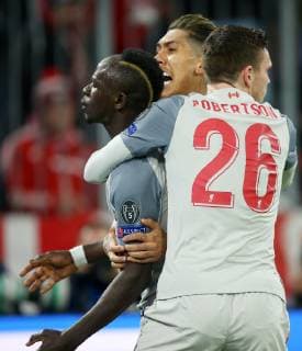 SOCCER - CL, Bayern vs Liverpool MUNICH,GERMANY,13.MAR.19 - SOCCER - UEFA Champions League, round of 16, FC Bayern Muenchen vs Liverpool FC. Image shows the rejoicing of Sadio Mane and Andy Robertson (Liverpool). GEPAxpictures xThomasxBachun
