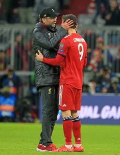 13.03.2019, CL, Champions League, Achtelfinale Rueckspiel, FC Bayern Muenchen vs FC Liverpool, Allianz Arena Muenchen , Fussball, im Bild: Trainer Juergen Klopp (FC Liverpool) und Robert Lewandowski (FCB) DFL REGULATIONS PROHIBIT ANY USE OF PHOTOGRAPHS AS IMAGE SEQUENCES AND OR QUASI VIDEO.