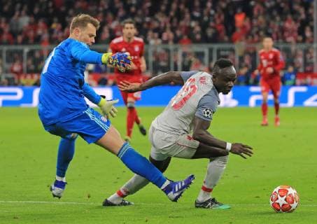 (190314) -- MUNICH, March 14, 2019 -- Liverpool s Sadio Mane (R) breaks through the defense of Bayern Munich s goalkeeper Manuel Neuer during the UEFA Champions League 1 8 finals second leg match between Bayern Munich of Germany and Liverpool of England in Munich, Germany, on March 13, 2019. Liverpool won 3-1 and advanced into the quarterfinals. ) (SP)GERMANY-MUNICH-SOCCER-UEFA CHAMPIONS LEAGUE-1 8 FINALS-BAYERN MUNICH VS LIVERPOOL PhilippexRuiz 