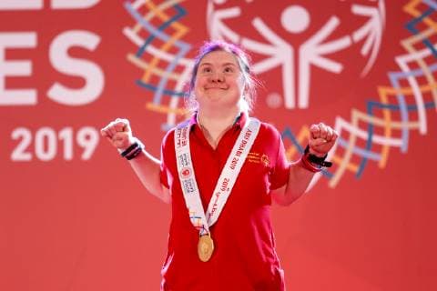 March 17, 2019 - Abu Dhabi, United Arab Emirates - Athlete from Romania shows her emotions when receiving their medals during declaration ceremony at the Special Olympics World Games in Abu Dhabi National Exhibition Centre, United Arab Emirates on March 17, 2019. Special Olympics is a worldwide organization which organize sports competitions for people with learning difficulties. Summer World Games take place every 4 years. 7500 athletes from nearly 200 countries compete in 24 Olympic disciplines in Abu Dhabi Games in 2019. Special Olympics In Abu Dhabi 2019  - ZUMAn230 20190317_zaa_n230_725 Copyright: xDominikaxZarzyckax