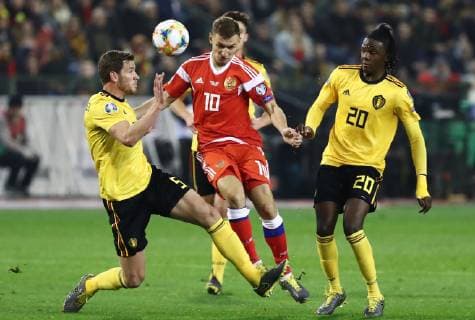 BRUSSELS, BELGIUM â€“ MARCH 21, 2019: Belgium s Jan Vertonghen (L), Dedryck Boyata (R) and Russia s Fyodor Chalov (C) in action in their UEFA EURO EM Europameisterschaft Fussball 2020 qualifying football match at King Baudouin Stadium. Anton Novoderezhkin TASS  TS0A5714