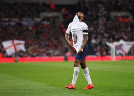 22nd March 2019, Wembley Stadium, London, England; UEFA European Championships Qualification football, England versus Czech Republic; Raheem Sterling of England celebrates scoring his sides 3rd goal in the 62nd minute to make it 3-0 with a t shirt in dedication to Damary Dawkins who passed away recently with acute lymphoblastic leukaemia  ActionPlus12116861 JohnxPatrickxFletcher