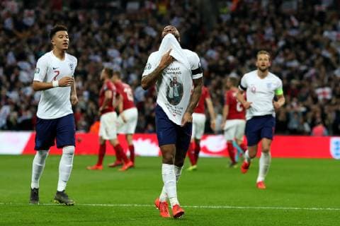 22nd March 2019, Wembley Stadium, London, England; UEFA European Championships Qualification football, England versus Czech Republic; Raheem Sterling of England celebrates as he scores for 3-0 in the 62nd minute by showing a t-shirt in memory of Damary Dawkins  ActionPlus12116862 ShaunxBrooks
