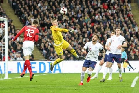 England Goalkeeper Jordan Pickford punches clear ahead of Lukas Masopust of Czech Republic during the UEFA EURO EM Europameisterschaft Fussball Qualifier EM Europameisterschaft Group A match between England and Czech Republic at Wembley Stadium, London, England on 22 March 2019. Copyright: xKenxSparksx 23420045
