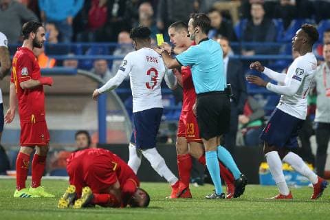 Montenegro v England UEFA EURO EM Europameisterschaft Fussball 2020 Qualifiers Danny Rose of England gets a yellow card from Referee Aleksei Kulbakov during the UEFA Euro 2020 Qualifiers match at the Podgorica City Stadium, Podgorica Content Not Available For UK Newspapers Copyright: xPaulxChestertonx FIL-13030-0123