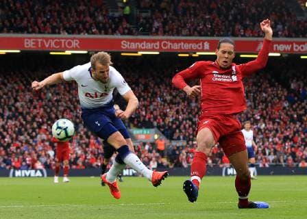 31st March 2019, Anfield, Liverpool, England; EPL Premier League football, Liverpool versus Tottenham Hotspur; Virgil van Dijk of Liverpool stretches to block a shot from Harry Kane of Tottenham Hotspur  ActionPlus12118908 DavidxBlunsden