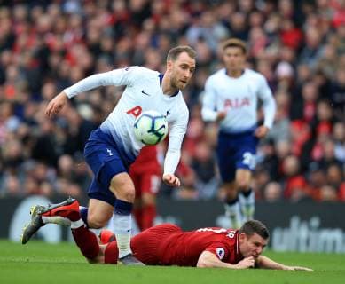 31st March 2019, Anfield, Liverpool, England; EPL Premier League football, Liverpool versus Tottenham Hotspur; James Milner of Liverpool and Christian Eriksen of Tottenham Hotspur collide as they compete for the ball  ActionPlus12118942 DavidxBlunsden