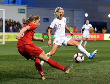 5th April 2019, Academy Stadium, Manchester, England; Womens International football friendly, England versus Canada; Janine Beckie of Canada crossed the ball into the penalty area as Rachel Daly of England attempts to block  ActionPlus12121018 DavidxBlunsden