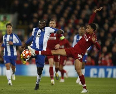 Moussa Marega FC Porto tackled by Trent Alexander-Arnold of Liverpool during the UEFA Champions League match at Anfield, Liverpool. Picture date: 9th April 2019. Picture credit should read: Andrew Yates Sportimage EDITORIAL USE ONLY. No use with unauthorised audio, video, data, fixture lists, club league logos or live services. Online in-match use limited to 120 images, no video emulation. No use in betting, games or single club league player publications. SPI-0024-0024