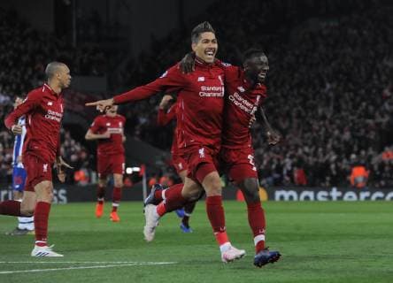 Football - 2018 2019 UEFA Champions League - Quarter-Final, First Leg: Liverpool vs. Porto Naby Keita of Liverpool celebrates scoring goal no 1, with Roberto Firmino at Anfield. COLORSPORT ANDREW COWIE 
