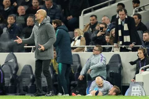 9th April 2019, Tottenham Hotspur Stadium, London, England; UEFA Champions League football, quarter final 1st leg, Tottenham Hotspur versus Manchester City; Harry Kane of Tottenham Hotspur shows signs of an ankle injury behind Manchester City Manager Josep Guardiola  ActionPlus12122382 ShaunxBrooks
