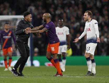 A fan runs onto the pitch and confronts Fabian Delph of Manchester Cityduring the UEFA Champions League match at the Tottenham Hotspur Stadium, London. Picture date: 9th April 2019. Picture credit should read: Darren Staples Sportimage EDITORIAL USE ONLY. No use with unauthorised audio, video, data, fixture lists, club league logos or live services. Online in-match use limited to 120 images, no video emulation. No use in betting, games or single club league player publications. SPI-0025-0073