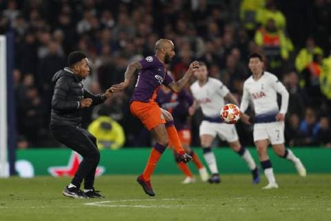 A fan runs onto the pitch during the UEFA Champions League match at the Tottenham Hotspur Stadium, London. Picture date: 9th April 2019. Picture credit should read: Darren Staples Sportimage EDITORIAL USE ONLY. No use with unauthorised audio, video, data, fixture lists, club league logos or live services. Online in-match use limited to 120 images, no video emulation. No use in betting, games or single club league player publications. SPI-0025-0074