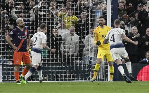 (190410) -- LONDON, April 10, 2019 (Xinhua) -- Tottenham Hotspur s goalkeeper Hugo Lloris (2nd R) celebrates after saving a penalty by Manchester City s Sergio Aguero (1st L) during the UEFA Champions League Quater Final First Leg match between Tottenham Hotspur and Manchester City at The Tottenham Hotspur Stadium in London, Britain on April 9, 2019. Tottenham Hotspur won 1-0. (Xinhua Han Yan) FOR EDITORIAL USE ONLY. NOT FOR SALE FOR MARKETING OR ADVERTISING CAMPAIGNS. NO USE WITH UNAUTHORIZED AUDIO, VIDEO, DATA, FIXTURE LISTS, CLUB LEAGUE LOGOS OR LIVE SERVICES. ONLINE IN-MATCH USE LIMITED TO 45 IMAGES, NO VIDEO EMULATION. NO USE IN BETTING, GAMES OR SINGLE CLUB LEAGUE PLAYER PUBLICATIONS. (SP)BRITAIN-LONDON-FOOTBALL-CHAMPIONS LEAGUE-QUARTERFINAL-TOT HOTSPUR VS MAN CITY 