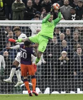(190410) -- LONDON, April 10, 2019 (Xinhua) -- Manchester City s Ederson (Above) jumps to save the ball during the UEFA Champions League Quater Final First Leg match between Tottenham Hotspur and Manchester City at The Tottenham Hotspur Stadium in London, Britain on April 9, 2019. Tottenham Hotspur won 1-0. (Xinhua Han Yan) FOR EDITORIAL USE ONLY. NOT FOR SALE FOR MARKETING OR ADVERTISING CAMPAIGNS. NO USE WITH UNAUTHORIZED AUDIO, VIDEO, DATA, FIXTURE LISTS, CLUB LEAGUE LOGOS OR LIVE SERVICES. ONLINE IN-MATCH USE LIMITED TO 45 IMAGES, NO VIDEO EMULATION. NO USE IN BETTING, GAMES OR SINGLE CLUB LEAGUE PLAYER PUBLICATIONS. (SP)BRITAIN-LONDON-FOOTBALL-CHAMPIONS LEAGUE-QUARTERFINAL-TOT HOTSPUR VS MAN CITY 