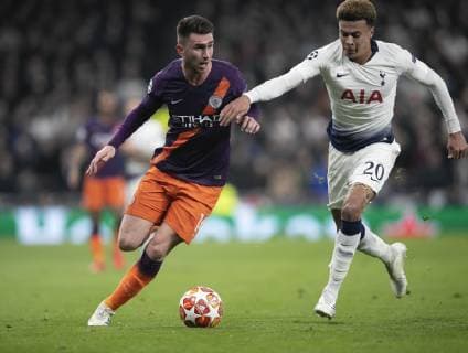 (190410) -- LONDON, April 10, 2019 (Xinhua) -- Tottenham Hotspur s Dele Alli (R) vies with Manchester City s Aymeric Laporte during the UEFA Champions League Quater Final First Leg match between Tottenham Hotspur and Manchester City at The Tottenham Hotspur Stadium in London, Britain on April 9, 2019. Tottenham Hotspur won 1-0. (Xinhua Han Yan) FOR EDITORIAL USE ONLY. NOT FOR SALE FOR MARKETING OR ADVERTISING CAMPAIGNS. NO USE WITH UNAUTHORIZED AUDIO, VIDEO, DATA, FIXTURE LISTS, CLUB LEAGUE LOGOS OR LIVE SERVICES. ONLINE IN-MATCH USE LIMITED TO 45 IMAGES, NO VIDEO EMULATION. NO USE IN BETTING, GAMES OR SINGLE CLUB LEAGUE PLAYER PUBLICATIONS. (SP)BRITAIN-LONDON-FOOTBALL-CHAMPIONS LEAGUE-QUARTERFINAL-TOT HOTSPUR VS MAN CITY 