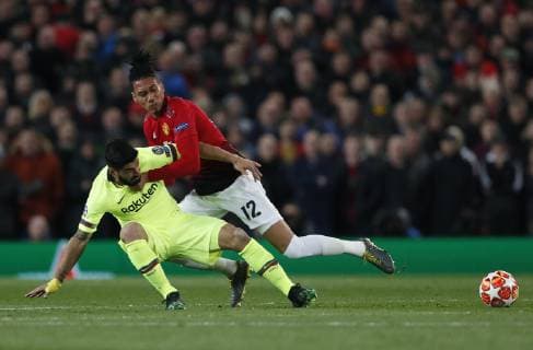 Luis Suarez of Barcelona tackled by Chris Smalling of Manchester United ManU during the UEFA Champions League match at Old Trafford, Manchester. Picture date: 10th April 2019. Picture credit should read: Darren Staples Sportimage EDITORIAL USE ONLY. No use with unauthorised audio, video, data, fixture lists, club league logos or live services. Online in-match use limited to 120 images, no video emulation. No use in betting, games or single club league player publications. SPI-0026-0022