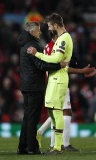 Ole Gunnar Solskjaer manager of Manchester United ManU hugs Gerard Pique of Barcelona during the UEFA Champions League match at Old Trafford, Manchester. Picture date: 10th April 2019. Picture credit should read: Darren Staples Sportimage EDITORIAL USE ONLY. No use with unauthorised audio, video, data, fixture lists, club league logos or live services. Online in-match use limited to 120 images, no video emulation. No use in betting, games or single club league player publications. SPI-0026-0052