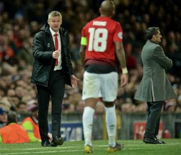 (190411) -- MANCHESTER, April 11, 2019 (Xinhua) -- Manchester United ManU s manager Ole Gunnar Solskjaer (L) issues instructions to Ashley Young during the UEFA Champions League Quarter-Final first leg match between Manchester United and FC Barcelona Barca at Old Trafford in Manchester, Britain on April 10, 2019. Barcelona won 1-0. (Xinhua) FOR EDITORIAL USE ONLY. NOT FOR SALE FOR MARKETING OR ADVERTISING CAMPAIGNS. NO USE WITH UNAUTHORIZED AUDIO, VIDEO, DATA, FIXTURE LISTS, CLUB LEAGUE LOGOS OR LIVE SERVICES. ONLINE IN-MATCH USE LIMITED TO 45 IMAGES, NO VIDEO EMULATION. NO USE IN BETTING, GAMES OR SINGLE CLUB LEAGUE PLAYER PUBLICATIONS. (SP)BRITAIN-MANCHESTER-FOOTBALL-CHAMPIONS LEAGUE-QUARTERFINAL-MAN UNITED VS BARCELONA
