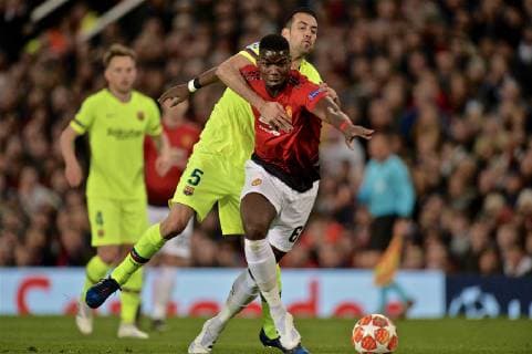 (190411) -- MANCHESTER, April 11, 2019 (Xinhua) -- Manchester United ManU s Paul Pogba (Front) vies with Sergio Busquets during the UEFA Champions League Quarter-Final first leg match between Manchester United and FC Barcelona Barca at Old Trafford in Manchester, Britain on April 10, 2019. Barcelona won 1-0. (Xinhua) FOR EDITORIAL USE ONLY. NOT FOR SALE FOR MARKETING OR ADVERTISING CAMPAIGNS. NO USE WITH UNAUTHORIZED AUDIO, VIDEO, DATA, FIXTURE LISTS, CLUB LEAGUE LOGOS OR LIVE SERVICES. ONLINE IN-MATCH USE LIMITED TO 45 IMAGES, NO VIDEO EMULATION. NO USE IN BETTING, GAMES OR SINGLE CLUB LEAGUE PLAYER PUBLICATIONS. (SP)BRITAIN-MANCHESTER-FOOTBALL-CHAMPIONS LEAGUE-QUARTERFINAL-MAN UNITED VS BARCELONA