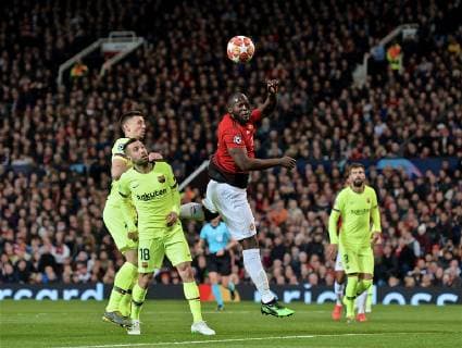 (190411) -- MANCHESTER, April 11, 2019 (Xinhua) -- Manchester United ManU s Romelu Lukaku (C) wins a header during the UEFA Champions League Quarter-Final first leg match between Manchester United and FC Barcelona Barca at Old Trafford in Manchester, Britain on April 10, 2019. Barcelona won 1-0. (Xinhua) FOR EDITORIAL USE ONLY. NOT FOR SALE FOR MARKETING OR ADVERTISING CAMPAIGNS. NO USE WITH UNAUTHORIZED AUDIO, VIDEO, DATA, FIXTURE LISTS, CLUB LEAGUE LOGOS OR LIVE SERVICES. ONLINE IN-MATCH USE LIMITED TO 45 IMAGES, NO VIDEO EMULATION. NO USE IN BETTING, GAMES OR SINGLE CLUB LEAGUE PLAYER PUBLICATIONS. (SP)BRITAIN-MANCHESTER-FOOTBALL-CHAMPIONS LEAGUE-QUARTERFINAL-MAN UNITED VS BARCELONA