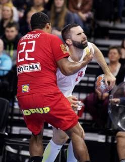 Mads Mensah Larsen og Milos Bozovic under EM kvalifikationskampen i herrehaandbold mellem Danmark og Montenegro, i Royal Arena loerdag den 13. april 2019.. , Copenhagen Denmark