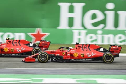 Monegasque racing driver Charles Leclerc, left, and German racing driver Sebastian Vettel of Scuderia Ferrari compete during the Formula One Heineken Chinese Grand Prix 2019 at the Shanghai International Circuit in Shanghai, China, 14 April 2019. F1 drivers compete in Formula One Heineken Chinese Grand Prix 2019 in Shanghai  scr183790