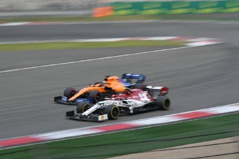 Italian Formula One driver Antonio Giovinazzi of Alfa Romeo Racing Ferrari, front, and Spanish Formula One driver Carlos Sainz compete in the Formula 1 Heineken Chinese Grand Prix 2019 at the Shanghai International Circuit in Shanghai, China, 14 April 2019. Lewis Hamilton wins landmark 1000th F1 race in Shanghai  20190414_503911