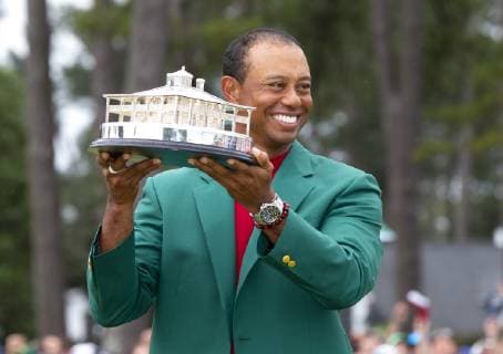 Tiger Woods holds the Masters Trophy wearing his newly won Green Jacket after the final round at the 2019 Masters Tournament at Augusta National Golf Club in Augusta, Georgia, on April 14, 2019. Tiger Woods wins the Masters with a score of 13 under par for his 5th Green Jacket.  AUG20190414920 JOHNxANGELILLO