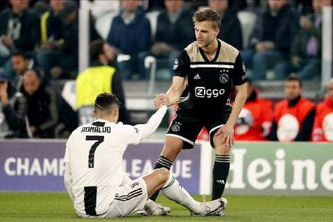 TORINO, Football,16-04-2019, Allianz Stadium . Champions League quarter finals second leg Juventus - Ajax. Juventus player Cristiano Ronaldo (L) with Ajax player Joel Veltman (R) during the game Juventus - Ajax . Juventus - Ajax  x3199549x