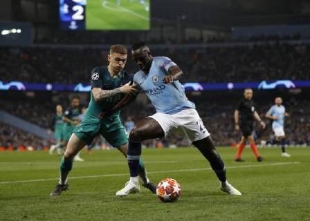 Benjamin Mendy of Manchester City holds off Kieran Trippier of Tottenham during the UEFA Champions League match at the Etihad Stadium, Manchester. Picture date: 17th April 2019. Picture credit should read: Darren Staples Sportimage EDITORIAL USE ONLY. No use with unauthorised audio, video, data, fixture lists, club league logos or live services. Online in-match use limited to 120 images, no video emulation. No use in betting, games or single club league player publications. SPI-0043-0018