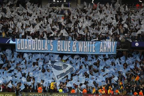 Manchester City fans wave their flags during the UEFA Champions League match at the Etihad Stadium, Manchester. Picture date: 17th April 2019. Picture credit should read: Darren Staples Sportimage EDITORIAL USE ONLY. No use with unauthorised audio, video, data, fixture lists, club league logos or live services. Online in-match use limited to 120 images, no video emulation. No use in betting, games or single club league player publications. SPI-0043-0019