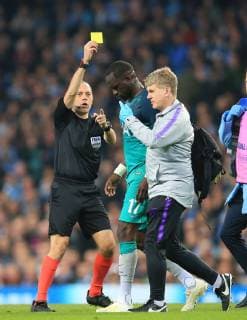 17th April 2019, Etihad Stadium, Manchester, England; UEFA Champions League football, quarter final 2nd leg, Manchester City versus Tottenham Hotspur; Moussa Sissoko of Tottenham Hotspur is shown a yellow card for time wasting as he leaves the field through injury  ActionPlus12124996 DavidxBlunsden