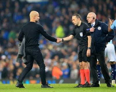 17th April 2019, Etihad Stadium, Manchester, England; UEFA Champions League football, quarter final 2nd leg, Manchester City versus Tottenham Hotspur; Manchester City manager Pep Guardiola shakes hands with referee Cuneyt Cakir after the final whistle  ActionPlus12125028 DavidxBlunsden