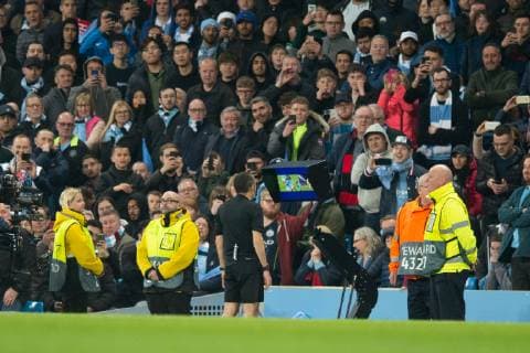 Manchester City v Tottenham Hotspur UEFA Champions League Referee Cuneyt Cakir looks at a replay of Fernando Llorente s goal on VAR before awarding the goal to make it 4-3 during the second leg of the UEFA Champions League quarter-final match at the Etihad Stadium, Manchester Content Not Available For UK Newspapers Copyright: xRussellxHartx FIL-13127-0064