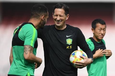 Brazilian football player Renato Soares de Oliveira Augusto, or simply Renato Augusto, left, and head coach Roger Schmidt of China s Beijing Sinobo Guoan take part in a training session before the group G match against Thailand s Buriram United during the 2019 AFC Champions League in Beijing, China, 23 April 2019. Beijing Sinobo Guoan gears up for 2019 AFC group G match  20190423_405071
