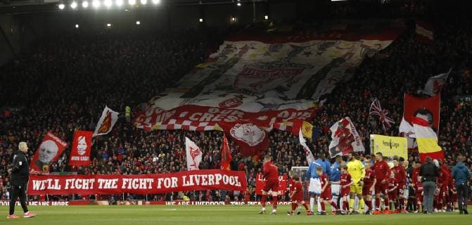 Fans with flags on the Spion Kop during the Premier League match at Anfield, Liverpool. Picture date: 26th April 2019. Picture credit should read: Darren Staples Sportimage EDITORIAL USE ONLY. No use with unauthorised audio, video, data, fixture lists, club league logos or live services. Online in-match use limited to 120 images, no video emulation. No use in betting, games or single club league player publications. SPI-0054-0021