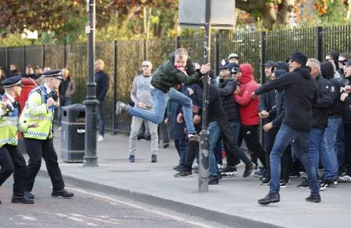 Ajax fans confront police with batons drawn before the UEFA Champions League match at the Tottenham Hotspur Stadium, London. Picture date: 30th April 2019. Picture credit should read: David Klein Sportimage EDITORIAL USE ONLY. No use with unauthorised audio, video, data, fixture lists, club league logos or live services. Online in-match use limited to 120 images, no video emulation. No use in betting, games or single club league player publications. SPI-0063-0009