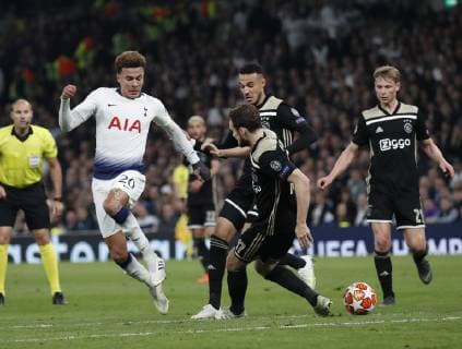 Dele Alli of Tottenham tacked by Daley Blind of Ajax during the UEFA Champions League match at the Tottenham Hotspur Stadium, London. Picture date: 30th April 2019. Picture credit should read: David Klein Sportimage EDITORIAL USE ONLY. No use with unauthorised audio, video, data, fixture lists, club league logos or live services. Online in-match use limited to 120 images, no video emulation. No use in betting, games or single club league player publications. SPI-0063-0122