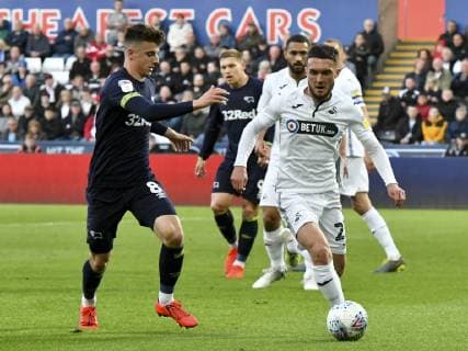 Football - 2018 2019 Sky Bet EFL Championship - Swansea City vs. Derby County Matt Grimes Swansea City challenged by BMason Mount Derby County, at The Liberty Stadium. COLORSPORT WINSTON BYNORTH 