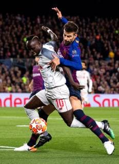 (190502) -- BARCELONA, May 2, 2019 -- FC Barcelona Barca s Gerard Pique (R) vies with Liverpool s Sadio Mane during the UEFA Champions League semifinal first leg soccer match between FC Barcelona and Liverpool in Barcelona, Spain, on May 1, 2019. Barcelona won 3-0. ) (SP)SPAIN-BARCELONA-SOCCER-UEFA CHAMPIONS LEAGUE-BARCELONA VS LIVERPOOL JoanxGosa 
