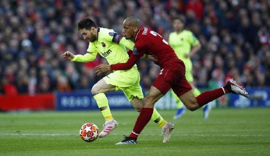 Football - 2018 2019 UEFA Champions League - Semi-Final, Second Leg: Liverpool (0) vs. Barcelona (3) Fabinho of Liverpool and Lionel Messi of Barcelona at Anfield. COLORSPORT LYNNE CAMERON 